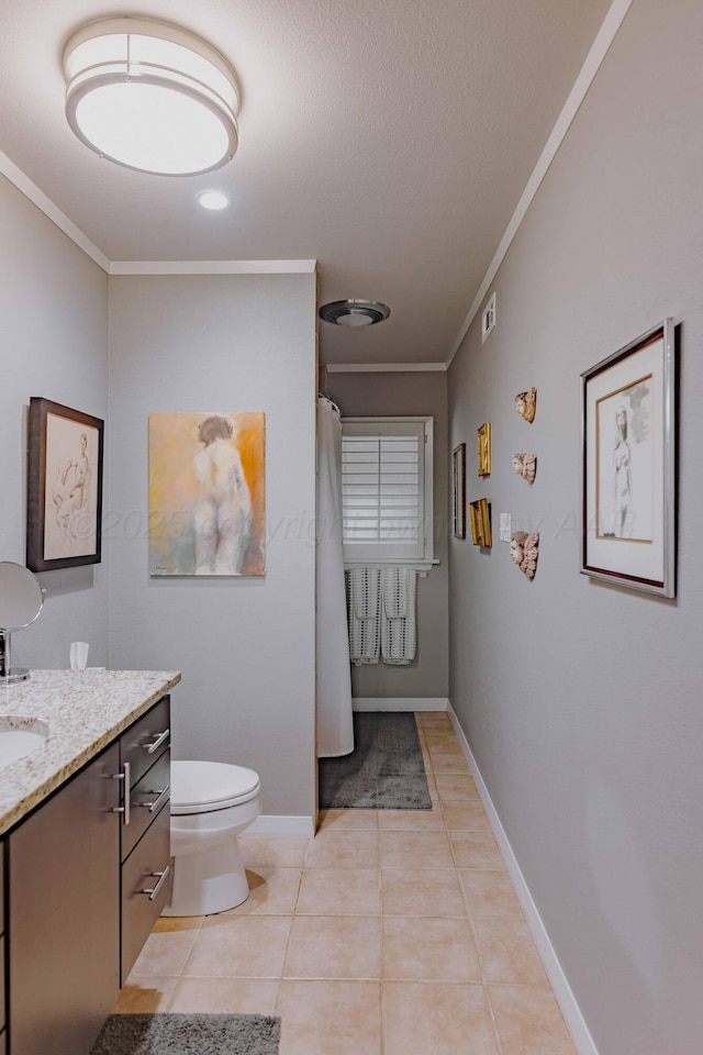 full bathroom with ornamental molding, vanity, toilet, tile patterned floors, and baseboards