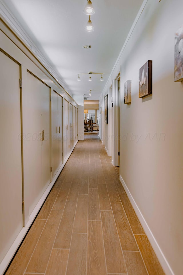 corridor with wood finished floors