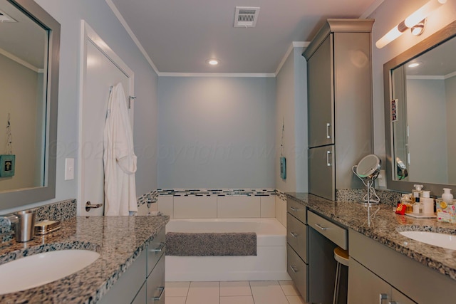 bathroom featuring ornamental molding, tile patterned floors, a garden tub, two vanities, and recessed lighting