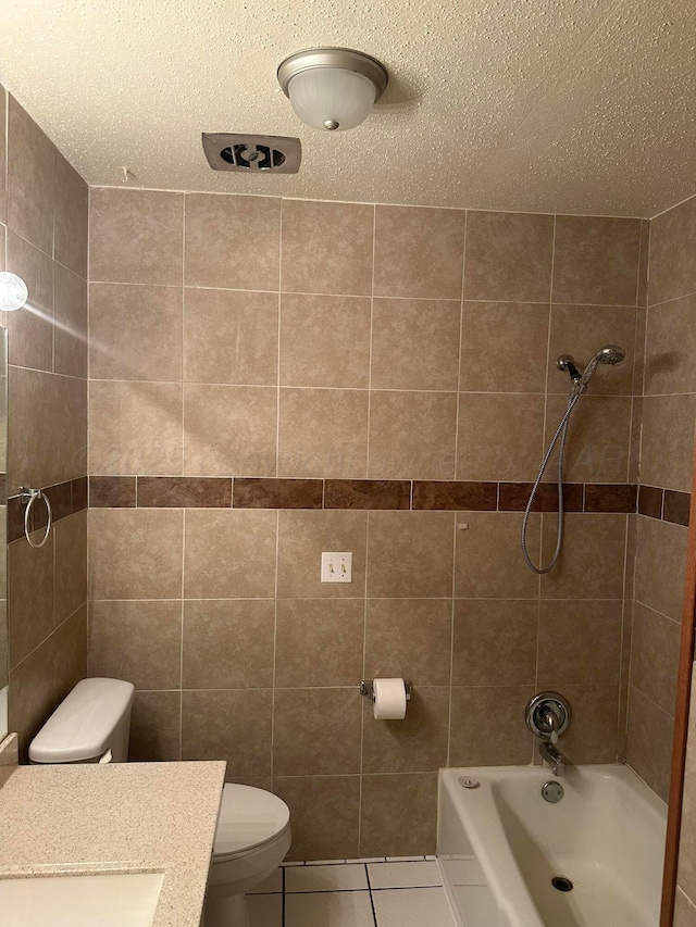 2810 Willbur Dr, Amarillo, TX 79110 - bathroom featuring tile patterned floors, washtub / shower combination, vanity, and a textured ceiling