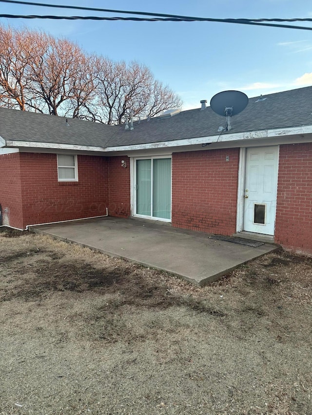 2810 Willbur Dr, Amarillo, TX 79110 - back of property with a patio and brick siding