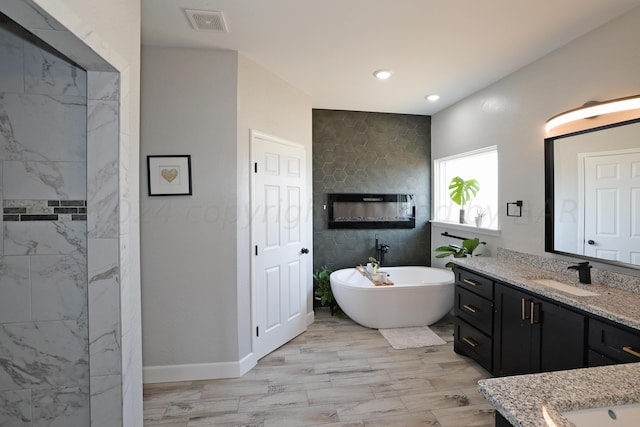 bathroom with a bathtub and vanity