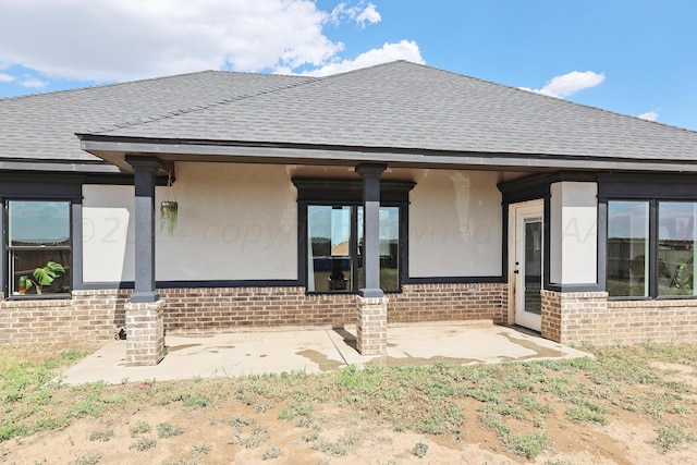 rear view of house with a patio