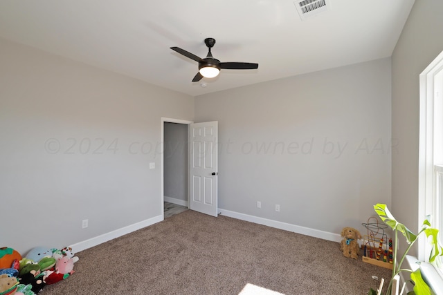 unfurnished bedroom featuring carpet flooring and ceiling fan