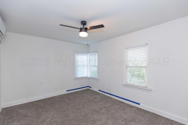carpeted empty room featuring plenty of natural light, a ceiling fan, baseboards, and crown molding