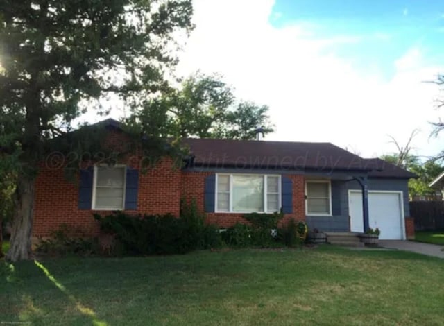 3912 Westlawn Ave, Amarillo, TX 79102 - single story home with an attached garage, brick siding, a front lawn, and concrete driveway