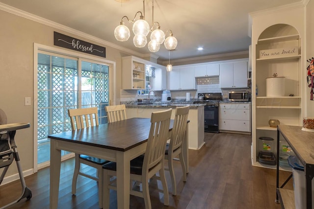 3102 S Bivins St, Amarillo, TX 79103 - dining space with ornamental molding, dark wood finished floors, and a chandelier