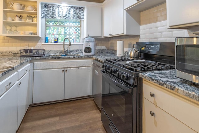 3102 S Bivins St, Amarillo, TX 79103 - kitchen featuring black gas range oven, dark wood finished floors, backsplash, and stone counters