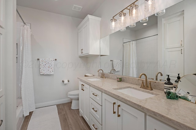 8100 Pensacola Ave, Amarillo, TX 79118 - bathroom with double vanity, wood finished floors, and shower / bathtub combination with curtain
