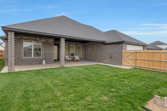 8100 Pensacola Ave, Amarillo, TX 79118 - rear view of house with brick siding, roof with shingles, and a patio