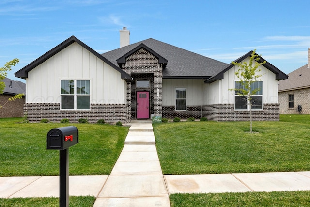 8100 Pensacola Ave, Amarillo, TX 79118 - view of front of house with brick siding, board and batten siding, and a front lawn