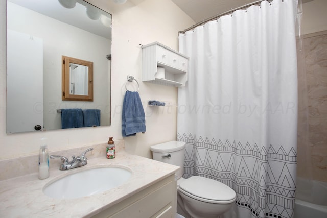 full bathroom featuring vanity, toilet, and shower / tub combo