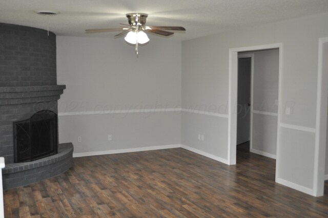 3411 Royal Rd, Amarillo, TX 79109 - unfurnished living room featuring a ceiling fan, dark wood finished floors, and a fireplace
