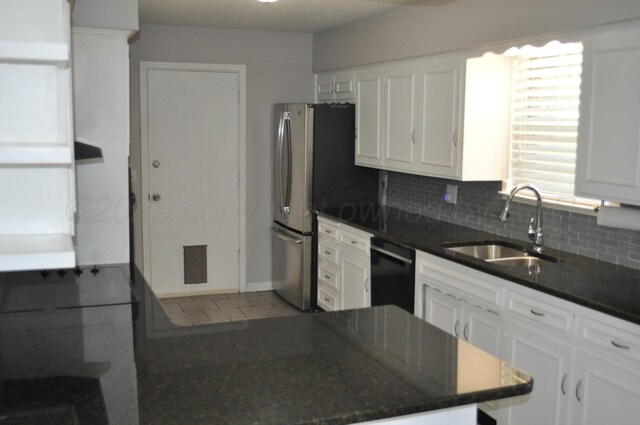 3411 Royal Rd, Amarillo, TX 79109 - kitchen featuring dishwasher, white cabinets, backsplash, dark stone counters, and tile patterned flooring