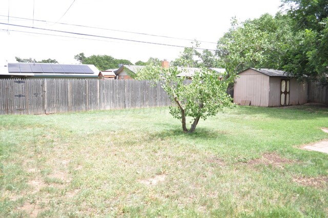 3411 Royal Rd, Amarillo, TX 79109 - fenced backyard with a storage unit