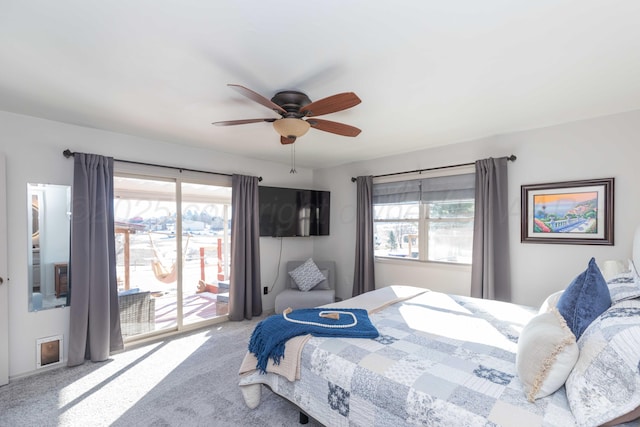 bedroom with carpet, ceiling fan, and access to outside