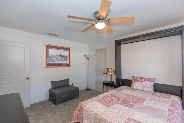 bedroom featuring light carpet and ceiling fan