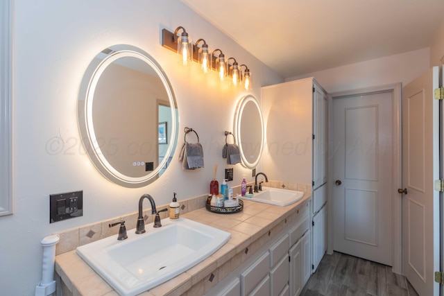 bathroom featuring vanity and hardwood / wood-style flooring