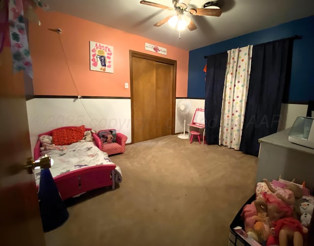 bedroom featuring ceiling fan and light colored carpet