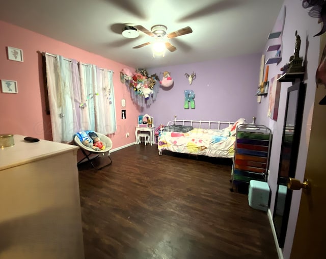 bedroom with dark wood-type flooring and ceiling fan