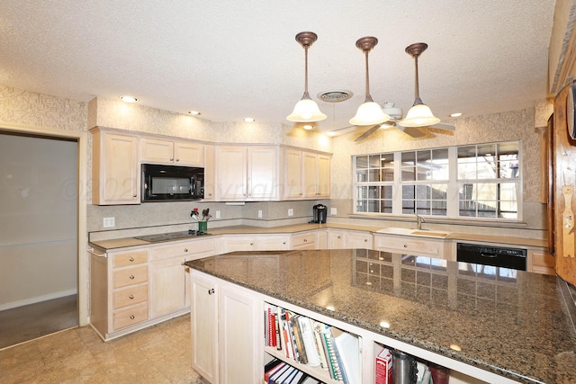 kitchen with sink, pendant lighting, dark stone counters, a textured ceiling, and black appliances