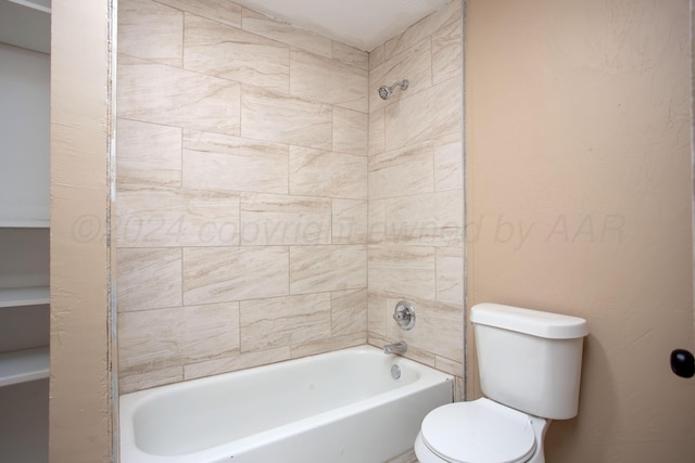 bathroom with toilet and tiled shower / bath combo