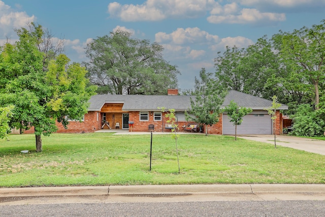 single story home featuring a garage and a front lawn