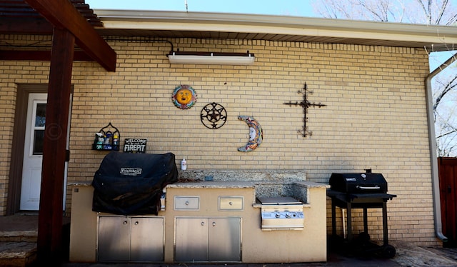 view of patio / terrace with grilling area and exterior kitchen