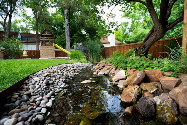 view of yard with a playground