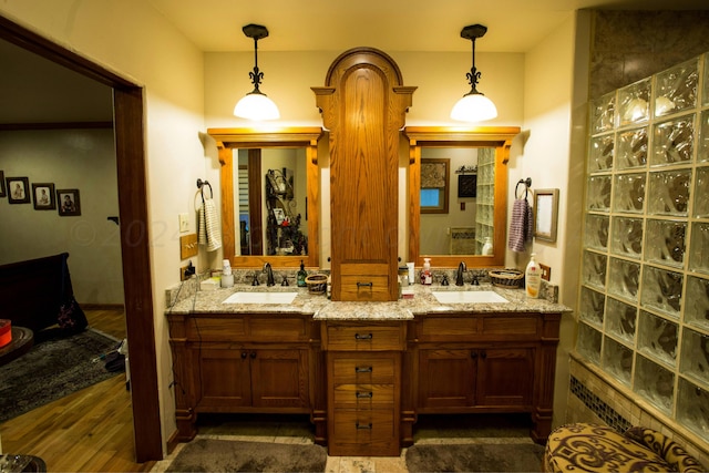 bathroom with vanity and hardwood / wood-style floors