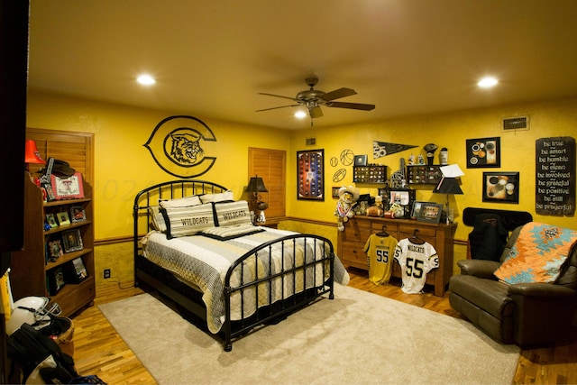 bedroom featuring hardwood / wood-style floors and ceiling fan