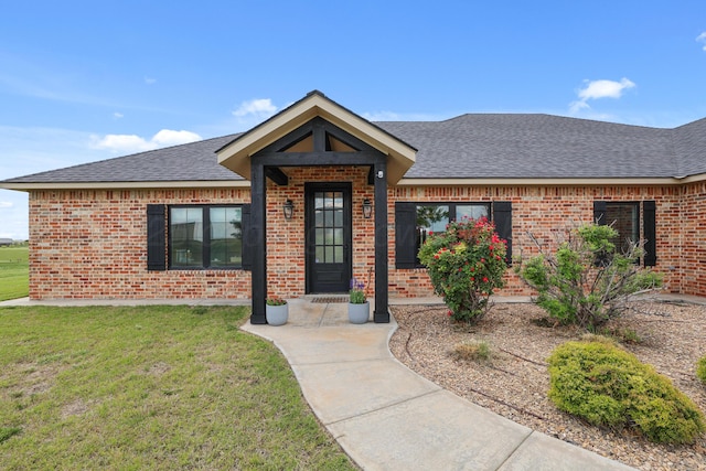 13050 Wilderness Trl, Amarillo, TX 79118 - ranch-style home with roof with shingles, a front lawn, and brick siding