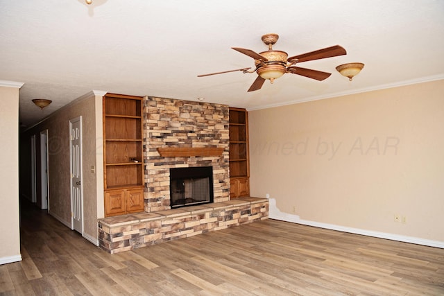 411 E 6th St, Hereford, TX 79045 - unfurnished living room with ceiling fan, ornamental molding, wood finished floors, and baseboards