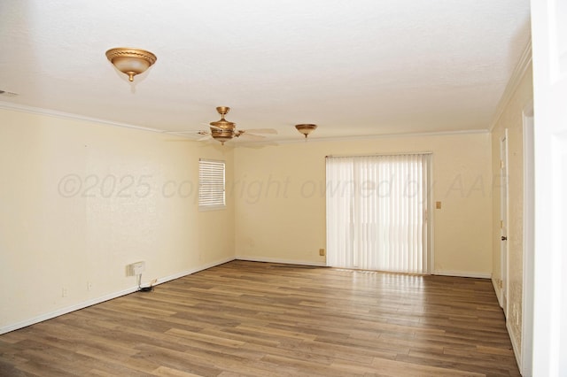 411 E 6th St, Hereford, TX 79045 - empty room featuring crown molding, ceiling fan, wood finished floors, and baseboards