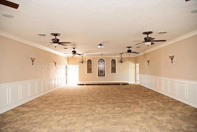 411 E 6th St, Hereford, TX 79045 - spare room with ceiling fan, ornamental molding, a decorative wall, carpet flooring, and a textured ceiling
