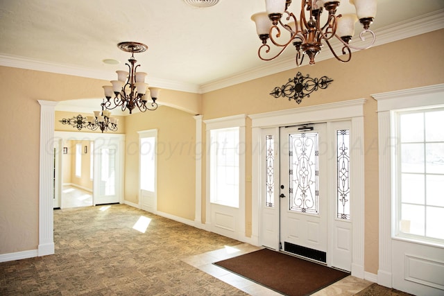 411 E 6th St, Hereford, TX 79045 - entryway featuring a chandelier, plenty of natural light, crown molding, and baseboards