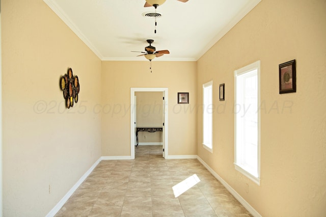 411 E 6th St, Hereford, TX 79045 - spare room with a ceiling fan, crown molding, and baseboards