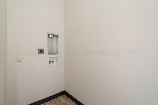 washroom featuring washer hookup, laundry area, electric dryer hookup, wood finished floors, and baseboards