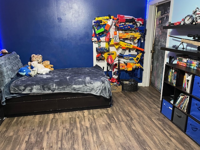 bedroom with wood finished floors