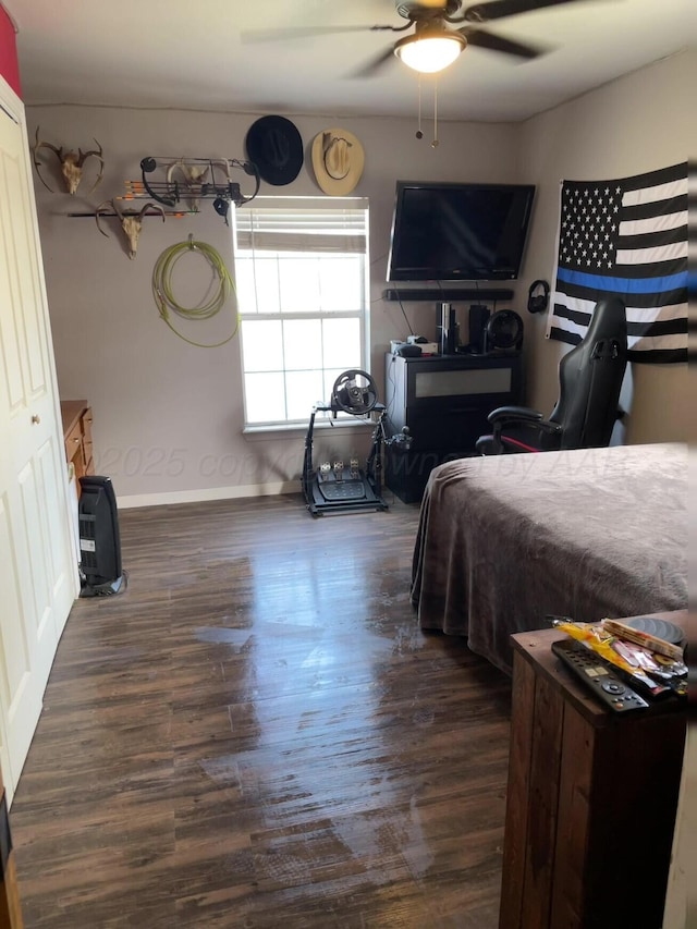 bedroom featuring a ceiling fan and wood finished floors