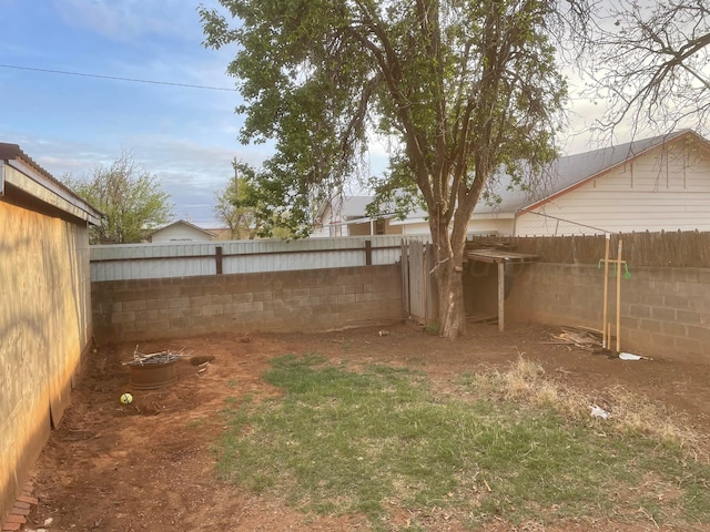 view of yard with a fenced backyard