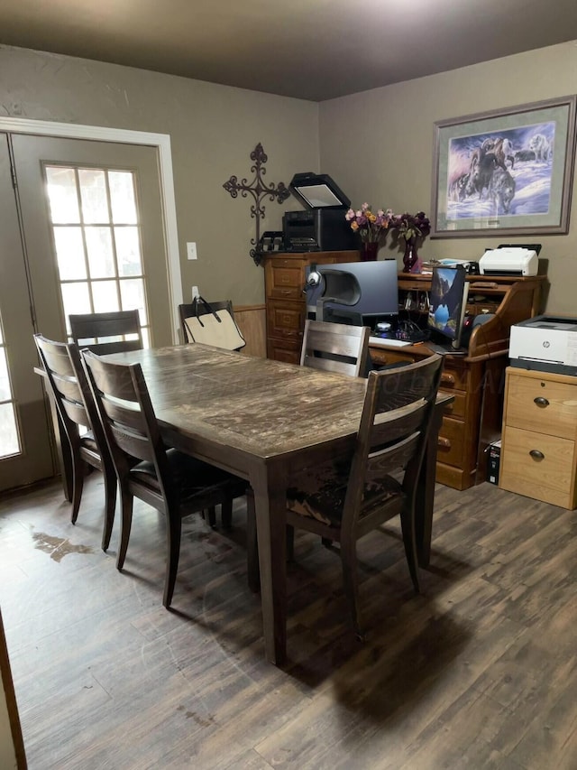 dining space with wood finished floors