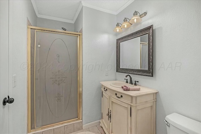 bathroom featuring vanity, toilet, ornamental molding, and a shower with shower door