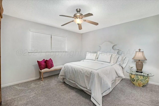 bedroom with carpet flooring, ceiling fan, and a textured ceiling