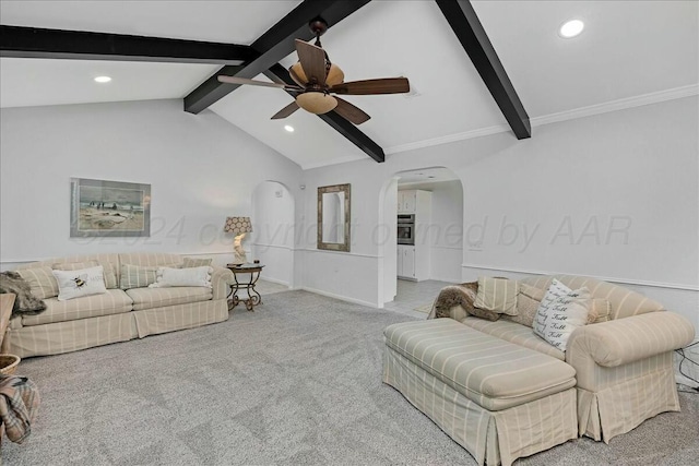 living room with lofted ceiling with beams, ceiling fan, light colored carpet, and crown molding