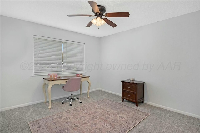 office area with ceiling fan and light carpet