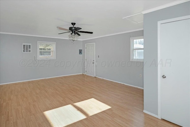 unfurnished room featuring light hardwood / wood-style floors, ceiling fan, and crown molding