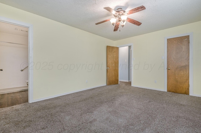 unfurnished bedroom with baseboards, a textured ceiling, and carpet