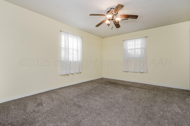 carpeted empty room featuring baseboards, a textured ceiling, and a ceiling fan