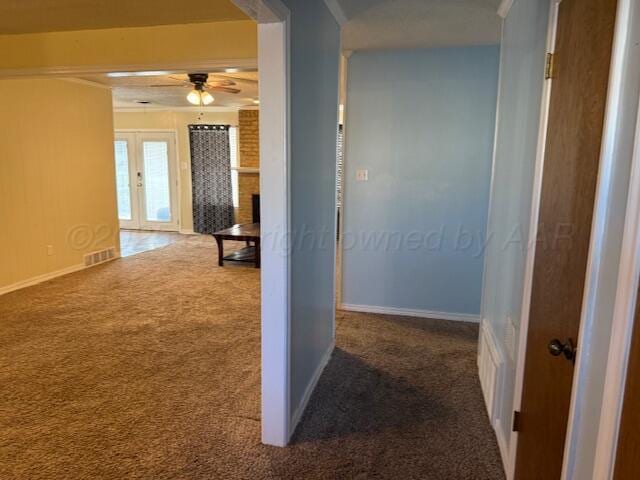 corridor featuring crown molding, carpet flooring, french doors, and visible vents